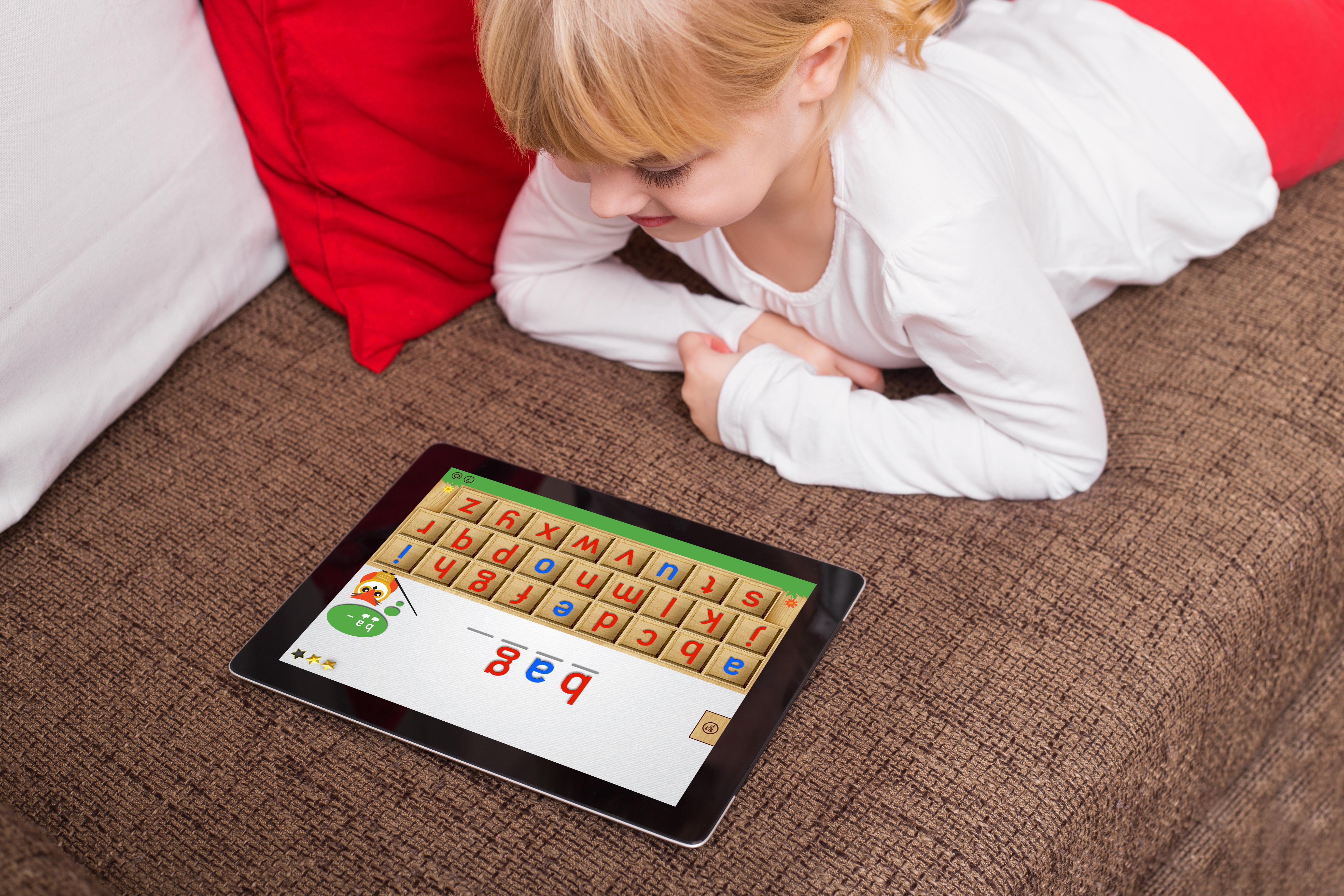 Child playing Dayzee Montessori Movable Alphabet